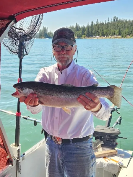 Mike Beighey displaying a massive Bass Lake trout
